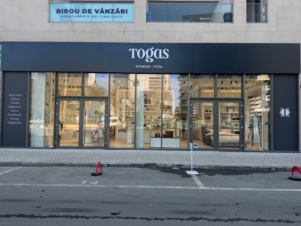 Completed flagship boutique storefront with illuminated logo